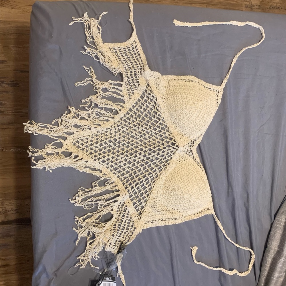 This is a knitted cropped blouse.